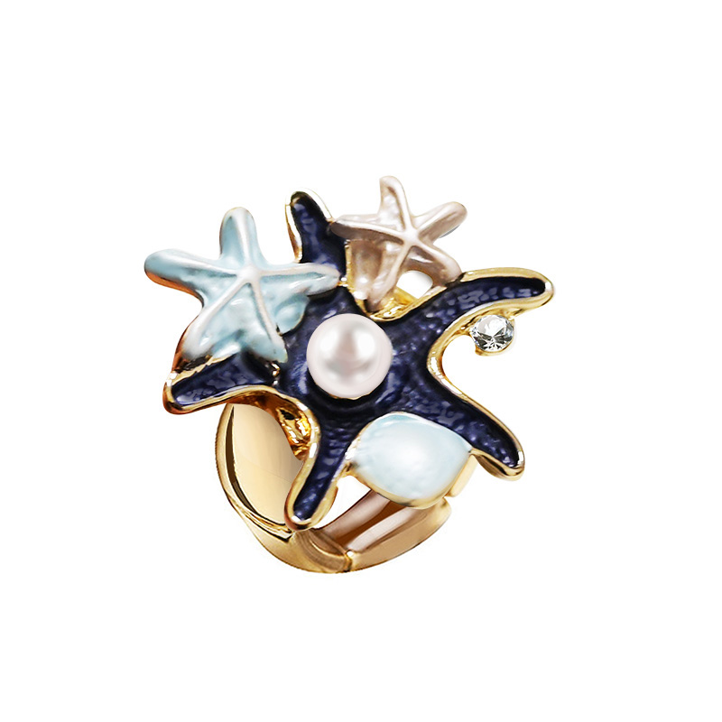 ANELLO ELASTICO CON STELLE MARINE SMALTATE E PERLA - SW25464C480