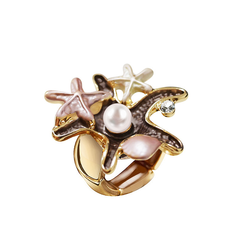 ANELLO ELASTICO CON STELLE MARINE SMALTATE E PERLA - SW25464C480