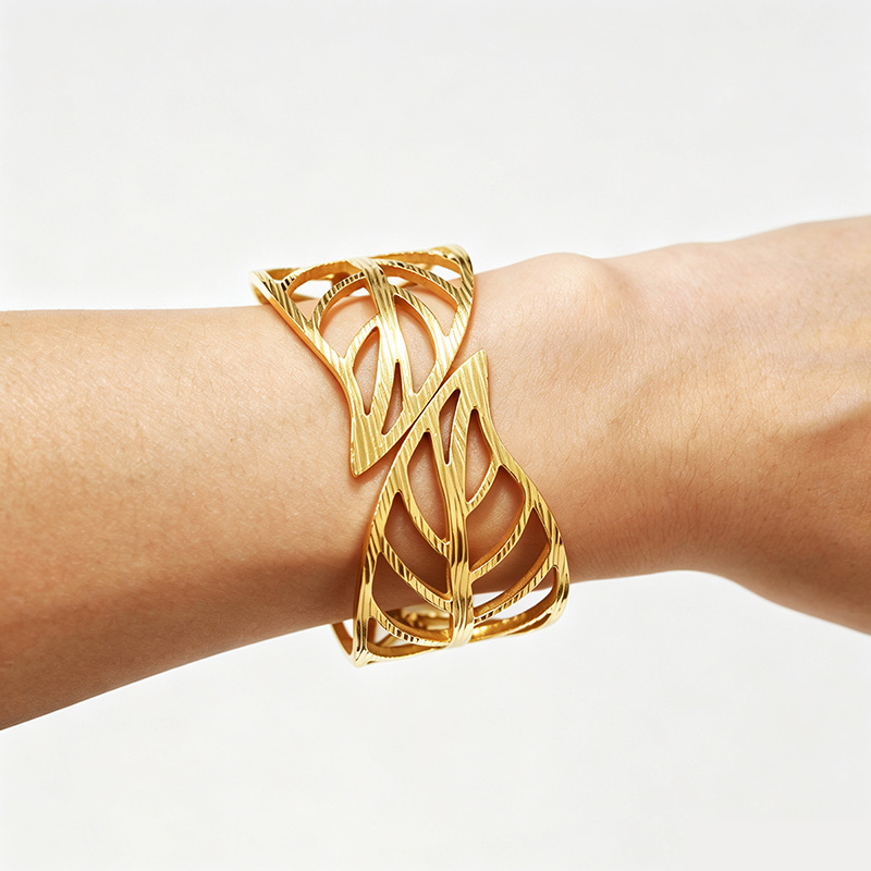 BRACCIALE RIGIDO A MOLLA CON FOGLIE TRAFORATE - DH2588B476