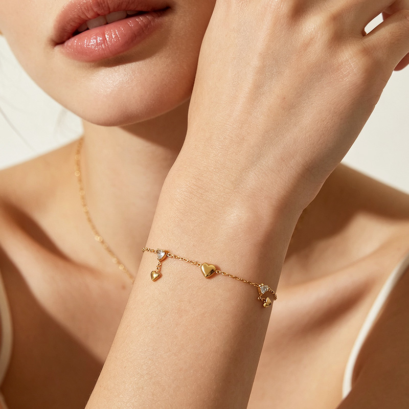 BRACCIALE CON CUORI PENDENTI E ZIRCONI - YC2684C940